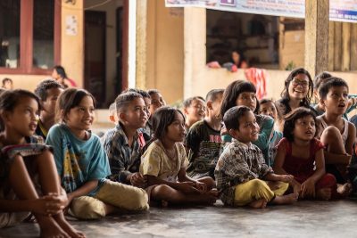 Image: Group of children watching a theatre show with wide-eyed wonder in their eyes -Wide-Eyed-Wonder - How We Work Wonders - Children's Entertainment